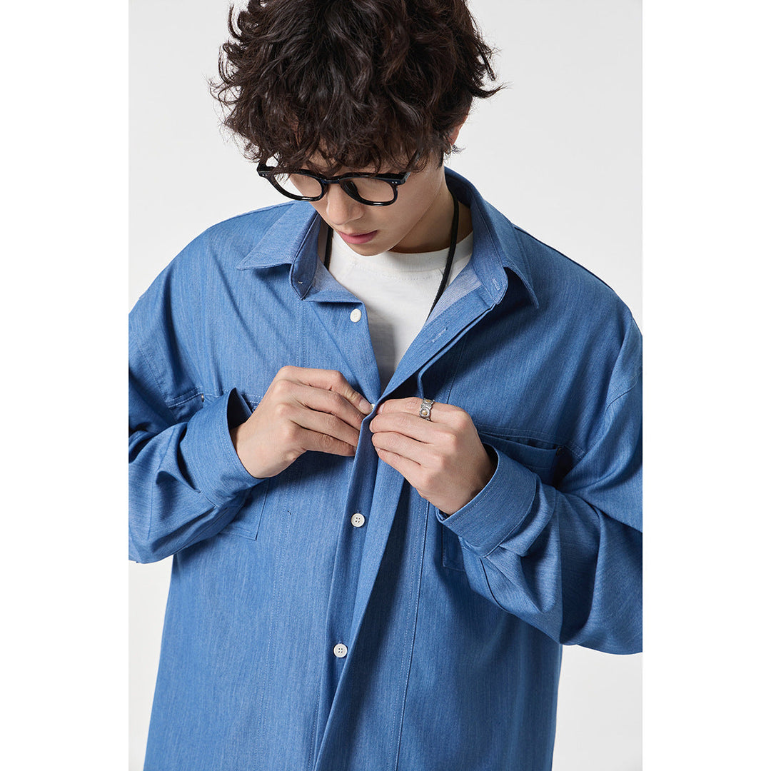 Męska oversize kurtka koszulowa z lekka denim quality z ukryty listwą guzikową i kieszeniami na piersi