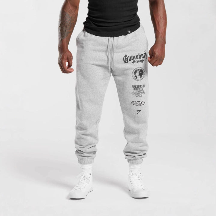 Męska tapered bawełna polar sweatpants z elastyczny ściągacz waistband, prążkowany nogawka otwory, i large logo print