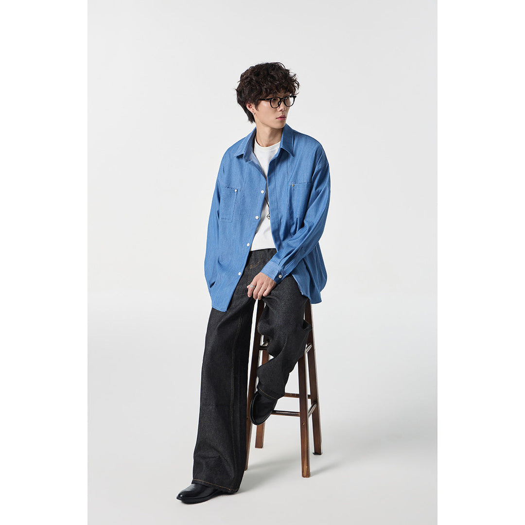 Męska oversize kurtka koszulowa z lekka denim quality z ukryty listwą guzikową i kieszeniami na piersi