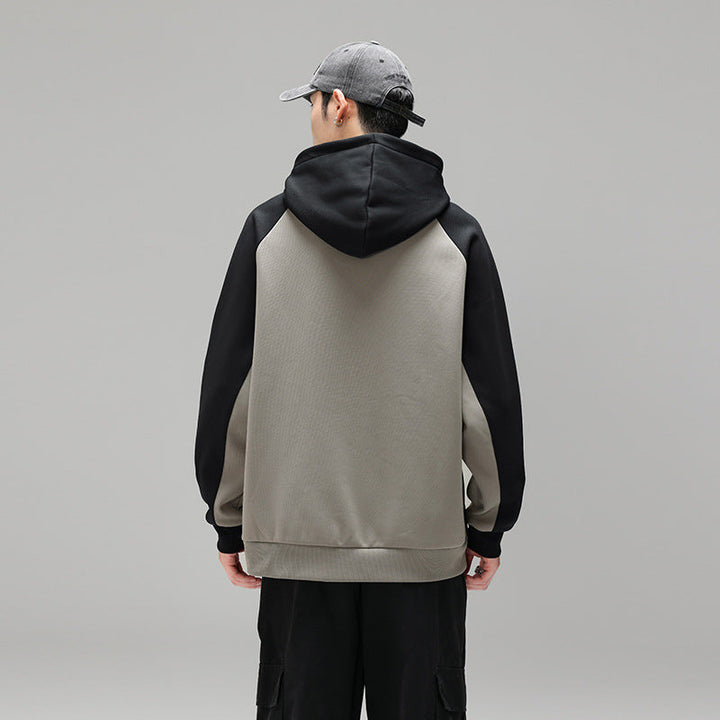 Herren Kapuzenpullover im Colourblock-Fason mit Raglanowyärmeln, Kängurutasche und geripptem Saum